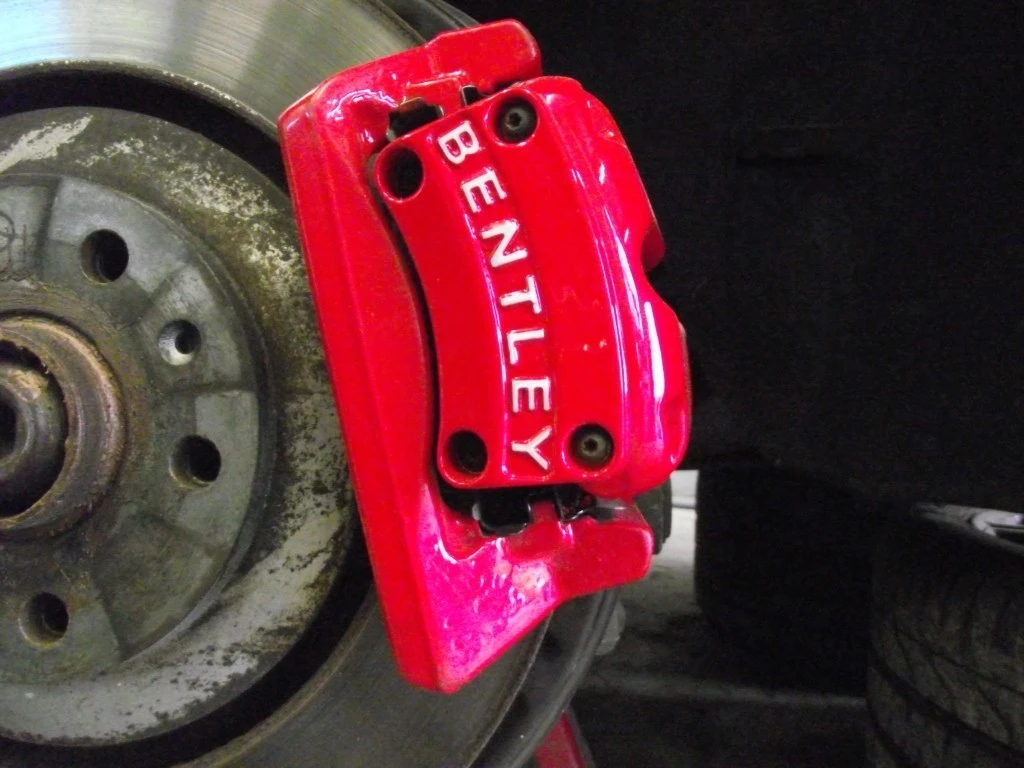 painted brake caliper in red for a bentley