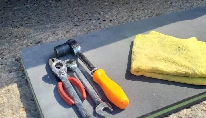 tools being prepared for brake repairs, such as brake pad and disc replacement.